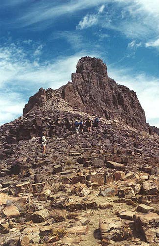 Hikers moving towards rugged false peak of Hayden